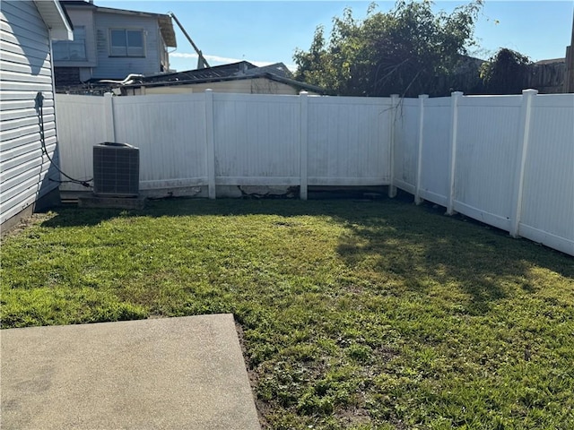 view of yard featuring cooling unit and a patio