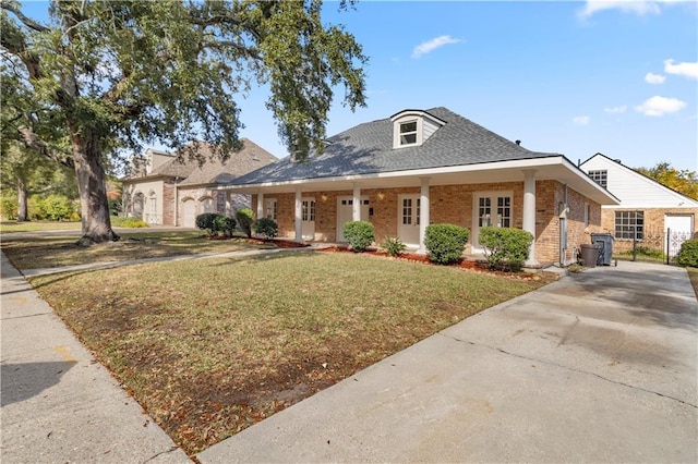 bungalow-style home featuring a front yard