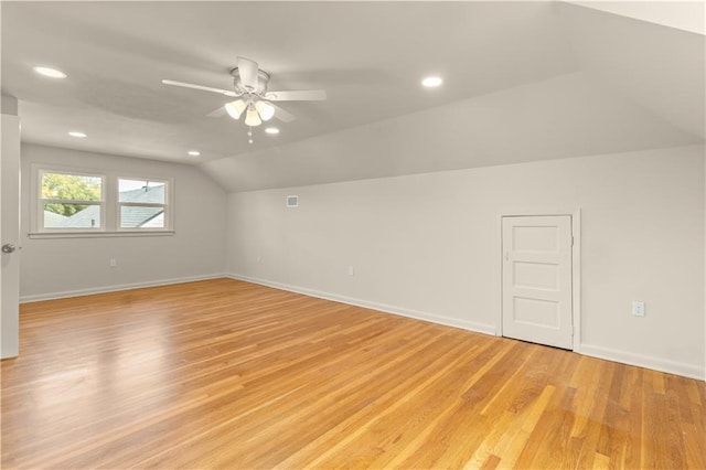 bonus room featuring vaulted ceiling, light hardwood / wood-style floors, and ceiling fan