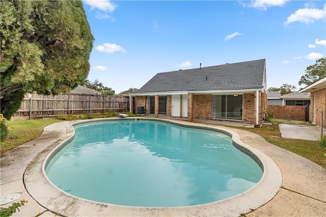 view of swimming pool with a patio area