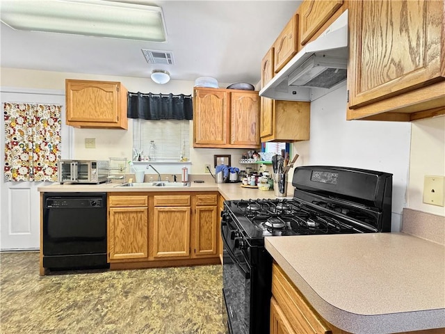 kitchen featuring sink and black appliances