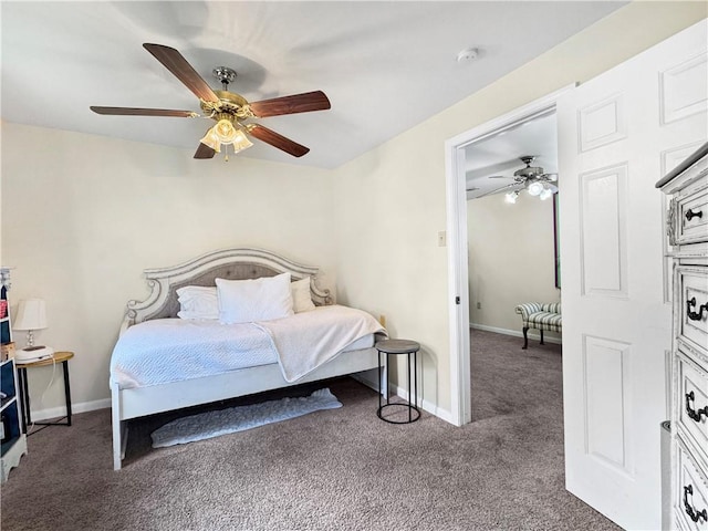 bedroom with ceiling fan and dark carpet