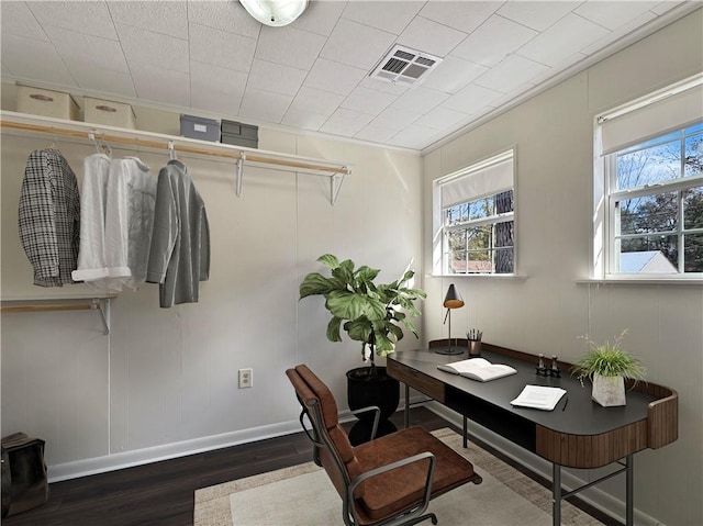 office area featuring ornamental molding and dark wood-type flooring