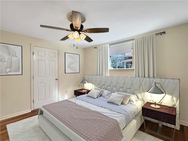 bedroom featuring ceiling fan and hardwood / wood-style floors