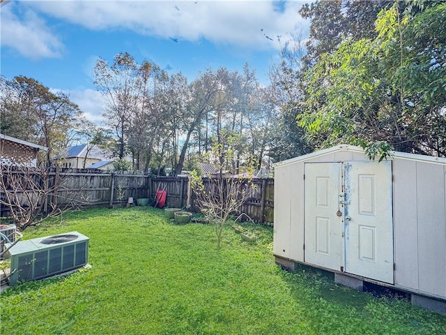 view of yard with a shed and central air condition unit