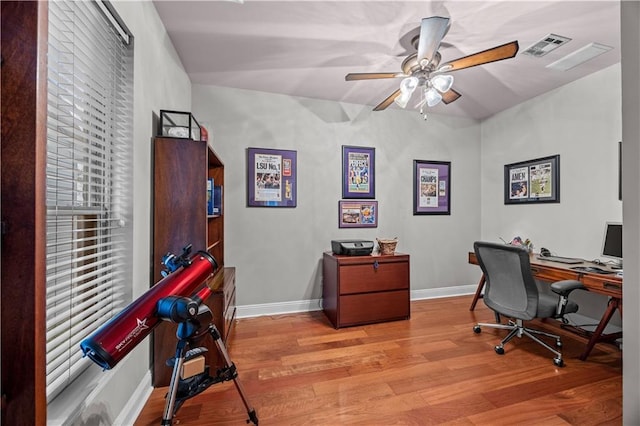 office area with ceiling fan and light hardwood / wood-style flooring