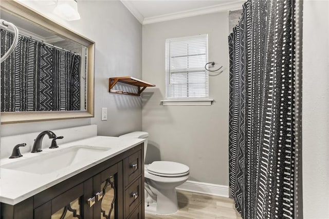 bathroom with vanity, toilet, wood-type flooring, and ornamental molding