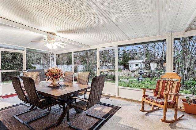 sunroom featuring ceiling fan