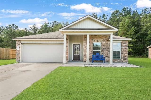 view of front of property with a front lawn, a porch, and a garage