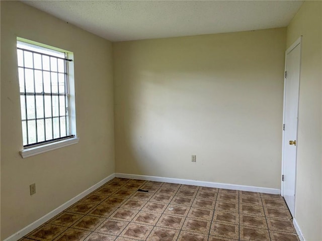 spare room featuring a wealth of natural light