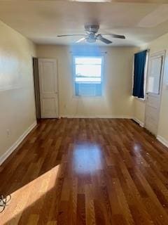 empty room featuring dark wood-type flooring