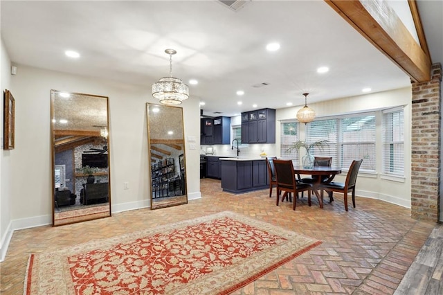 dining space with a notable chandelier