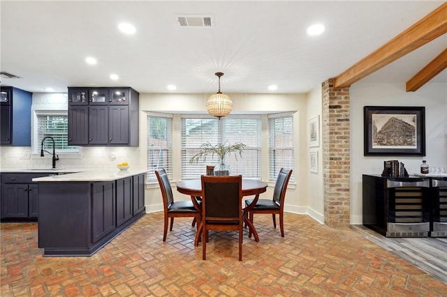 dining room with sink and a wealth of natural light