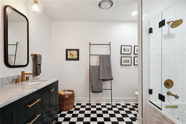 full bathroom with toilet, vanity, and combined bath / shower with glass door