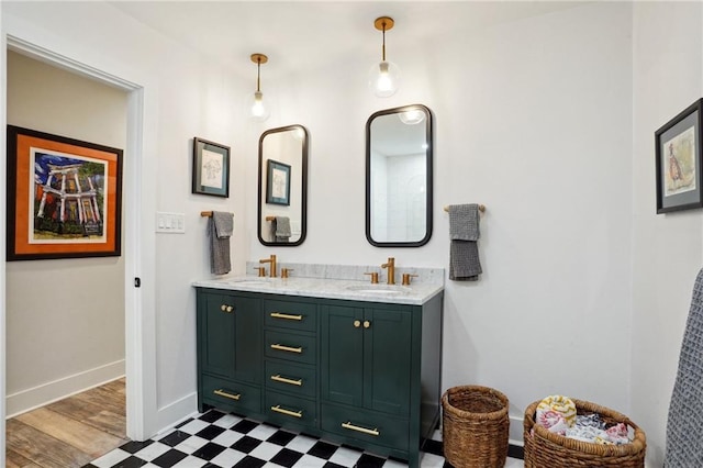 bathroom with hardwood / wood-style flooring and vanity