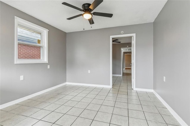 unfurnished room featuring light tile patterned floors and ceiling fan