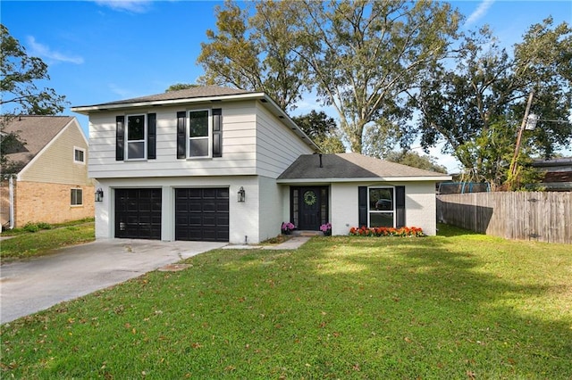 front of property with a front yard and a garage