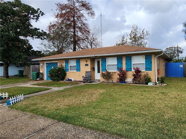 ranch-style home with a front lawn