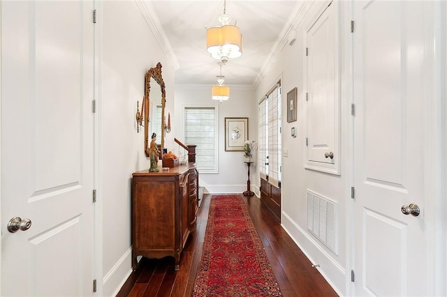 interior space with ornamental molding and dark hardwood / wood-style floors