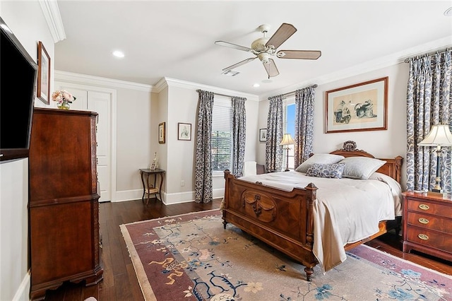 bedroom featuring crown molding, dark wood-type flooring, and ceiling fan