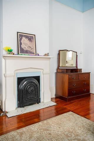 unfurnished room featuring dark hardwood / wood-style flooring