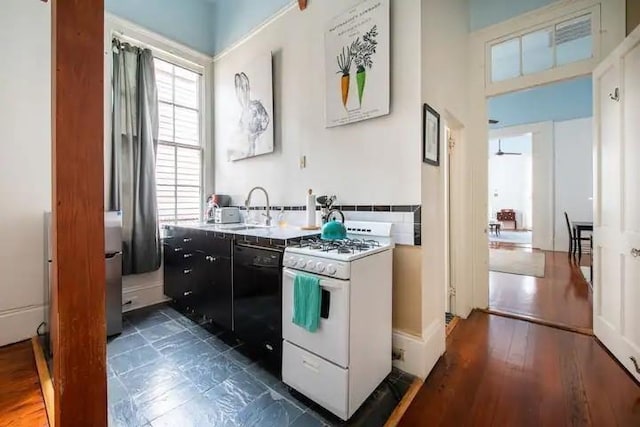 kitchen with sink, white range with gas stovetop, and black dishwasher