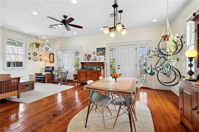 dining area with ceiling fan and light wood-type flooring