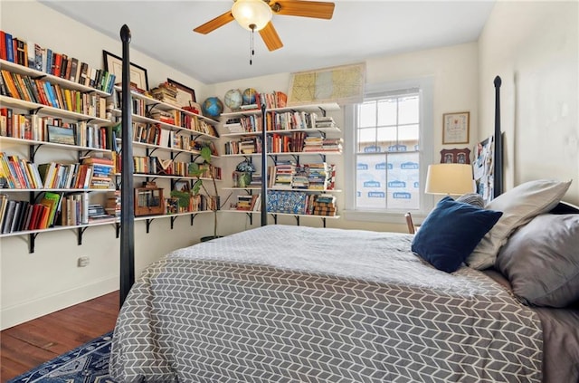 bedroom with ceiling fan and hardwood / wood-style flooring