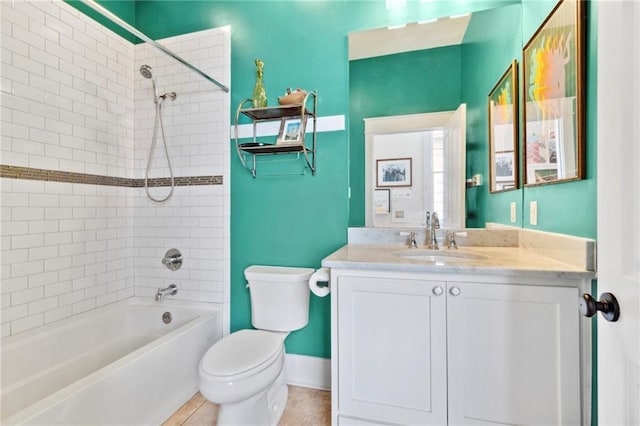 full bathroom with tile patterned floors, toilet, vanity, and tiled shower / bath