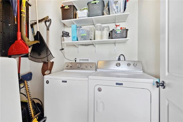 clothes washing area featuring separate washer and dryer