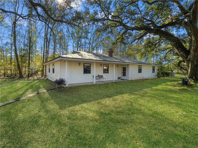 ranch-style house featuring a patio area and a front yard