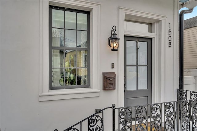 1508 N Roman St, New Orleans, LA 70116 - view of exterior entry featuring stucco siding