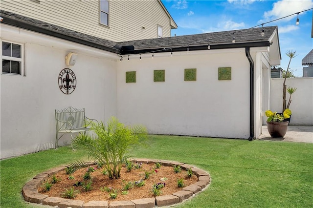 1508 N Roman St, New Orleans, LA 70116 - view of side of property featuring a yard, stucco siding, and fence