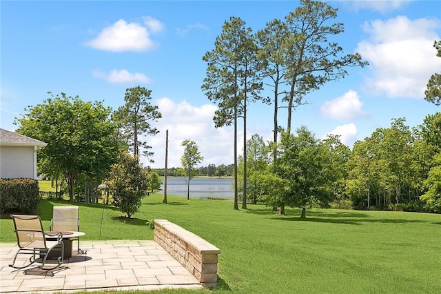 view of home's community featuring a patio and a lawn