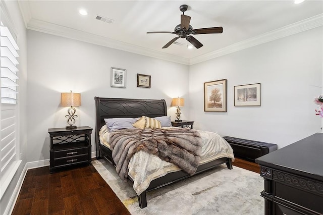 bedroom with dark hardwood / wood-style floors, ceiling fan, and crown molding