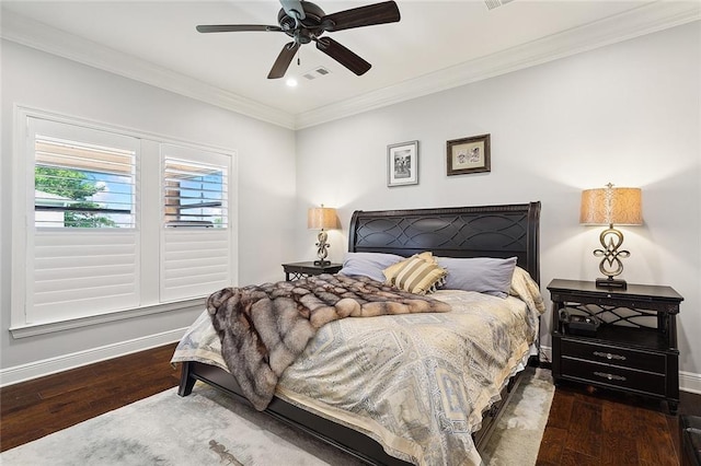 bedroom featuring dark hardwood / wood-style floors, ceiling fan, and ornamental molding