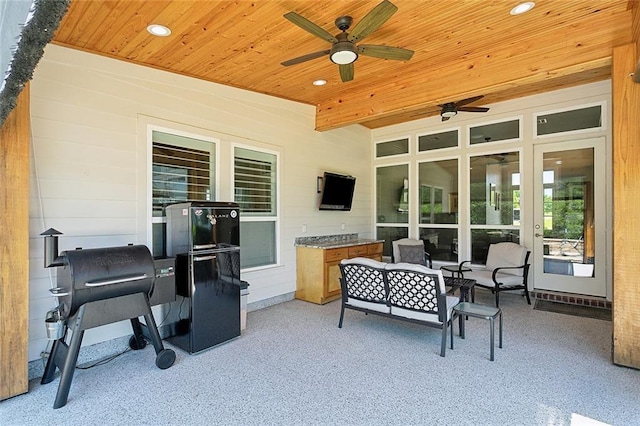 view of patio / terrace with an outdoor living space and ceiling fan