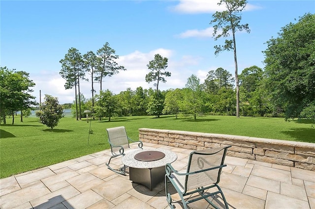 view of patio / terrace featuring an outdoor fire pit