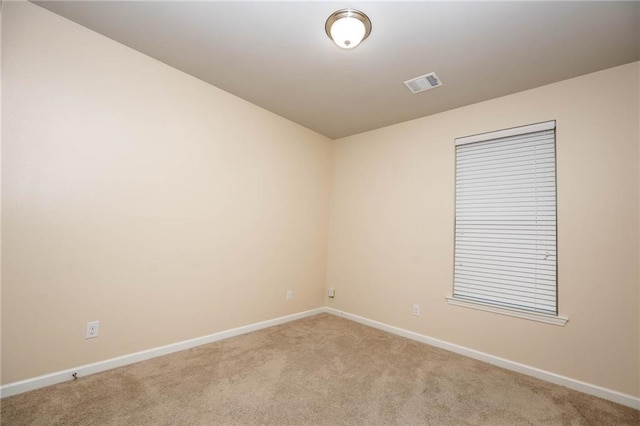 unfurnished room with light colored carpet