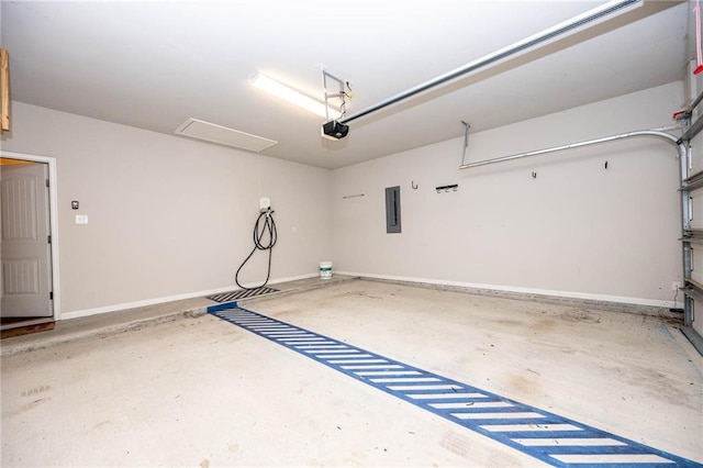 garage with electric panel and a garage door opener