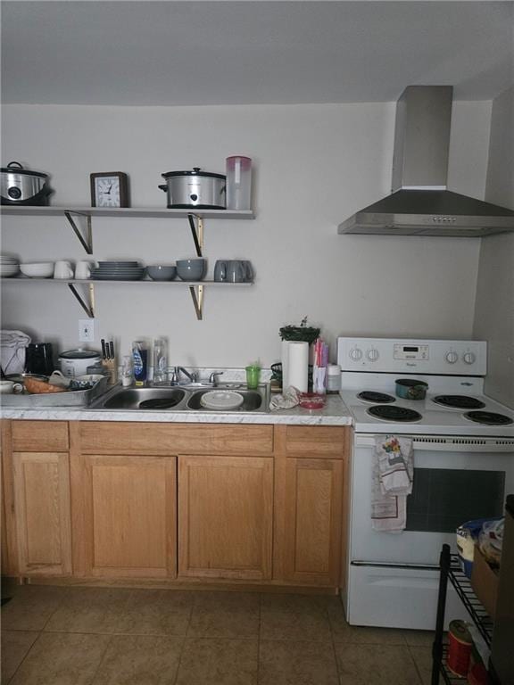 kitchen featuring electric range, tile patterned flooring, sink, and wall chimney range hood