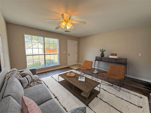 living room with hardwood / wood-style flooring and ceiling fan