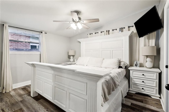 bedroom with dark hardwood / wood-style floors and ceiling fan