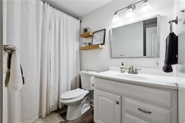 bathroom featuring vanity, toilet, and wood-type flooring