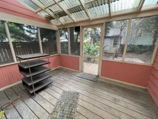 unfurnished sunroom with vaulted ceiling