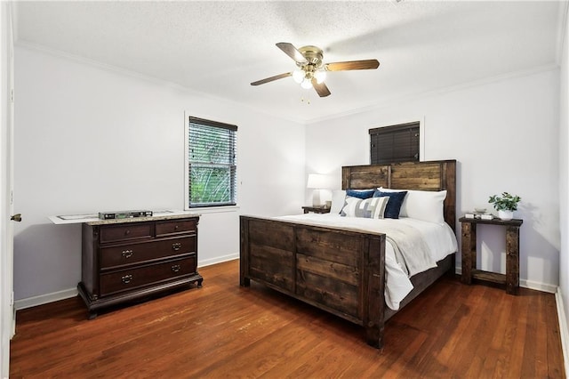 bedroom with ceiling fan, dark hardwood / wood-style flooring, a textured ceiling, and crown molding