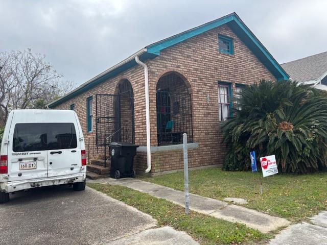 view of property exterior with a yard