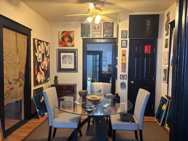 dining space featuring ceiling fan