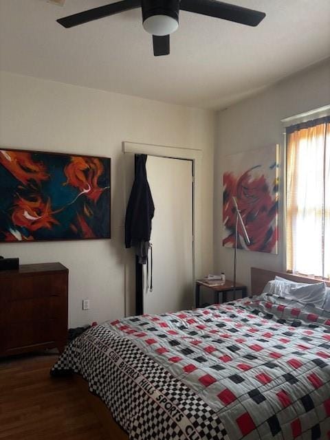 bedroom with hardwood / wood-style flooring and ceiling fan