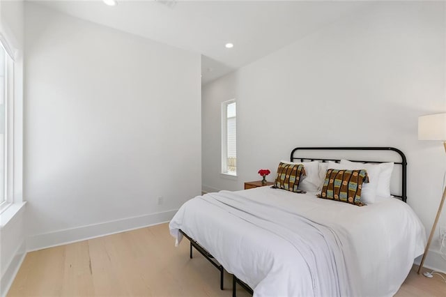 bedroom with light wood-type flooring